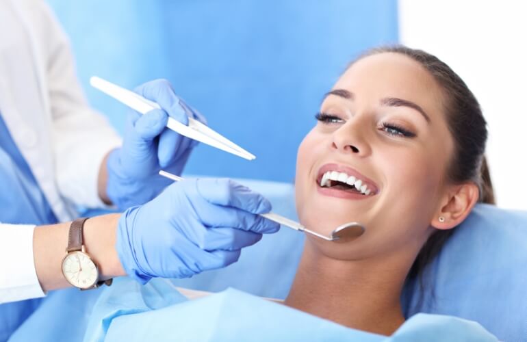 Patient smiling during dental treatment