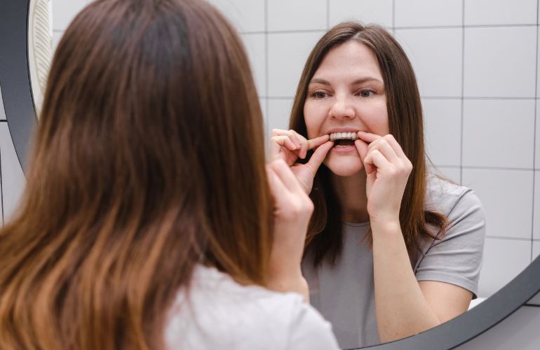 Women wearing invisalign