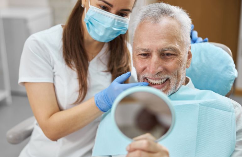 A smiling man in a dentist chair