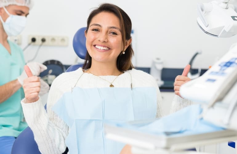 Happy patient smiling after treatment.