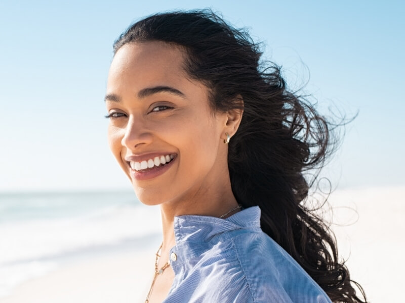 Women holding invisible aligners