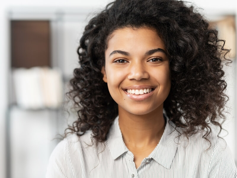 Smiling woman with curly hair