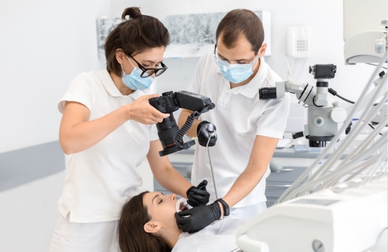 A dentist examines a patient in a modern dental office